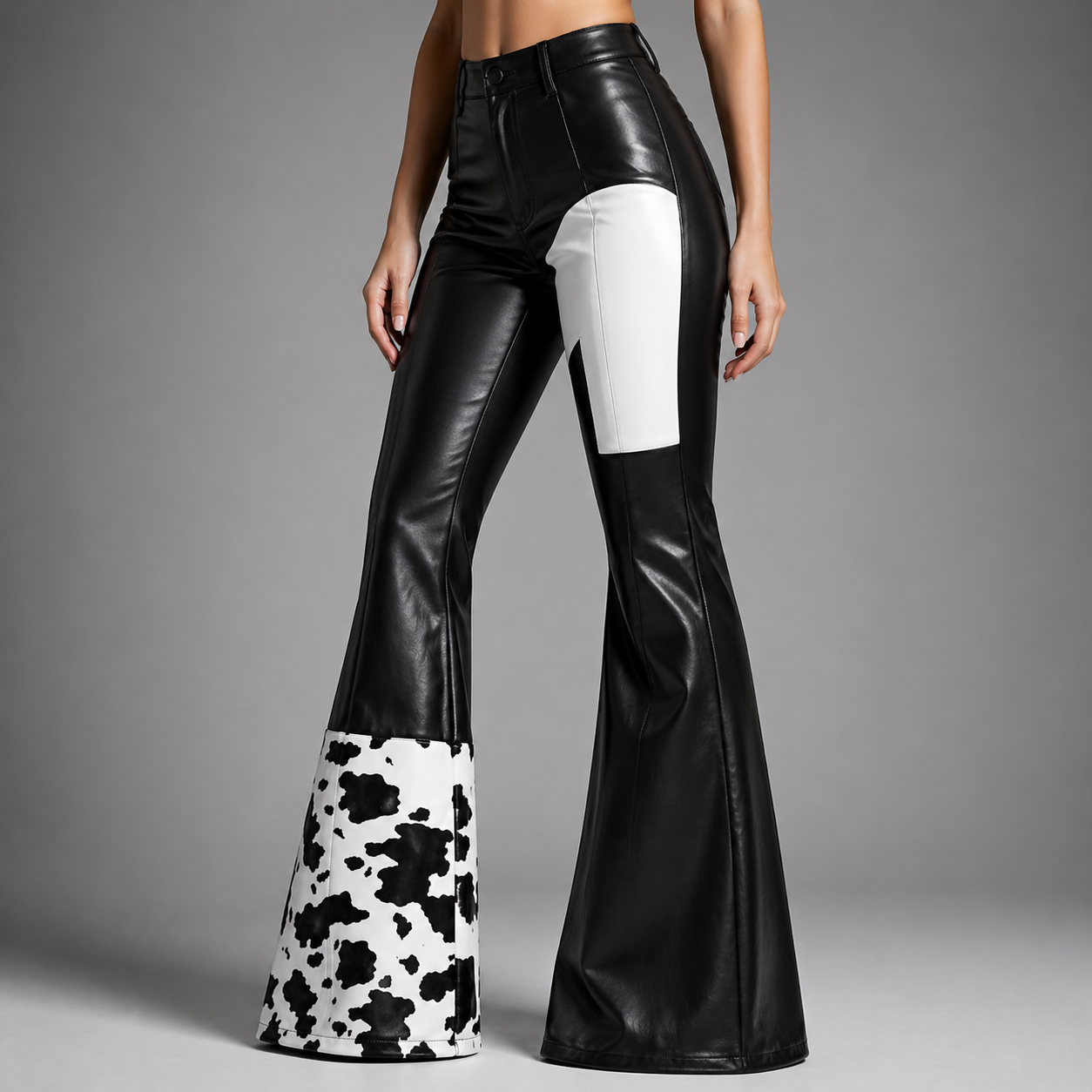 Side view of black high-rise flare pants with contrast panels