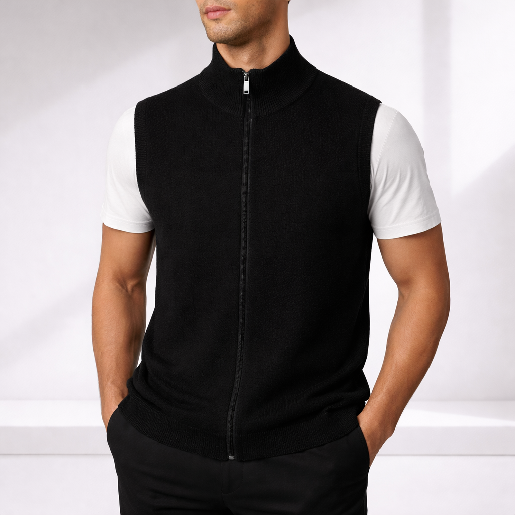 Man wearing a black ribbed knit full-zip sweater vest over a white t-shirt