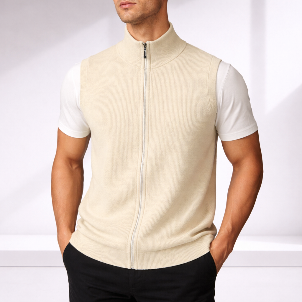 Man wearing a beige ribbed knit full-zip sweater vest over a white t-shirt