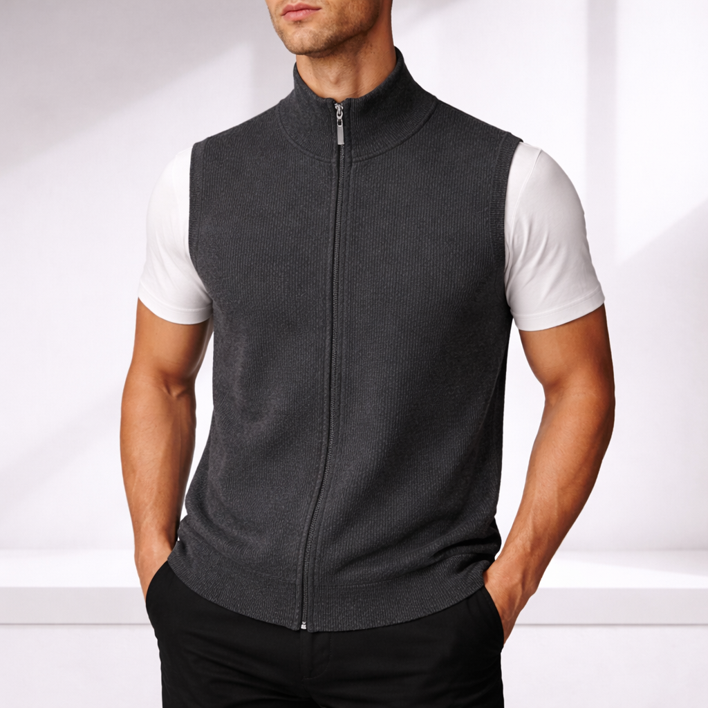 Man wearing a gray ribbed knit full-zip sweater vest over a white t-shirt