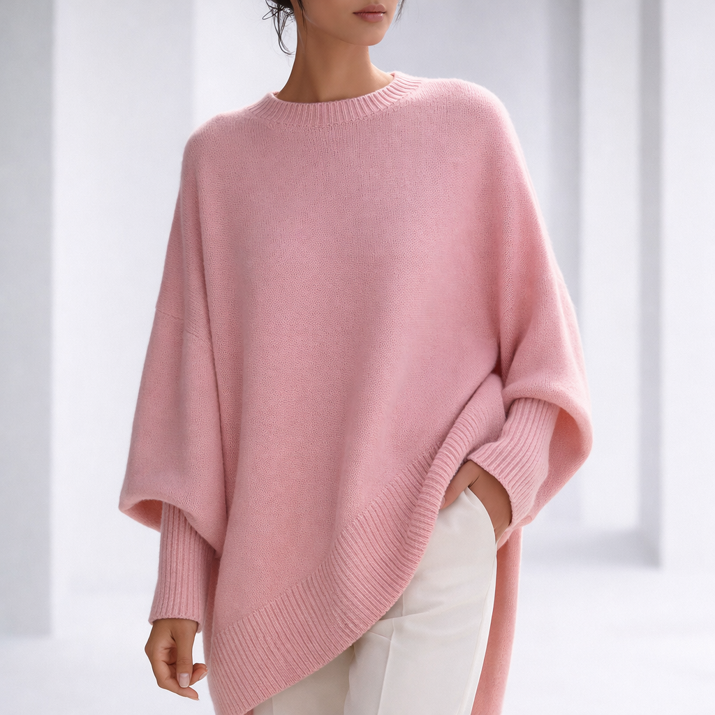 Women's Oversized Crewneck Sweater with Ribbed Cuffs and Hem in Pink, worn in a bright studio