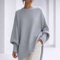 Women's Oversized Crewneck Sweater with Ribbed Cuffs and Hem in Gray, worn in a bright studio