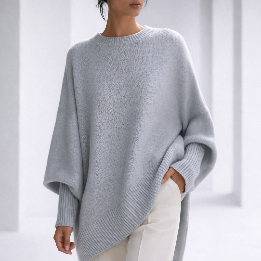 Women's Oversized Crewneck Sweater with Ribbed Cuffs and Hem in Gray, worn in a bright studio