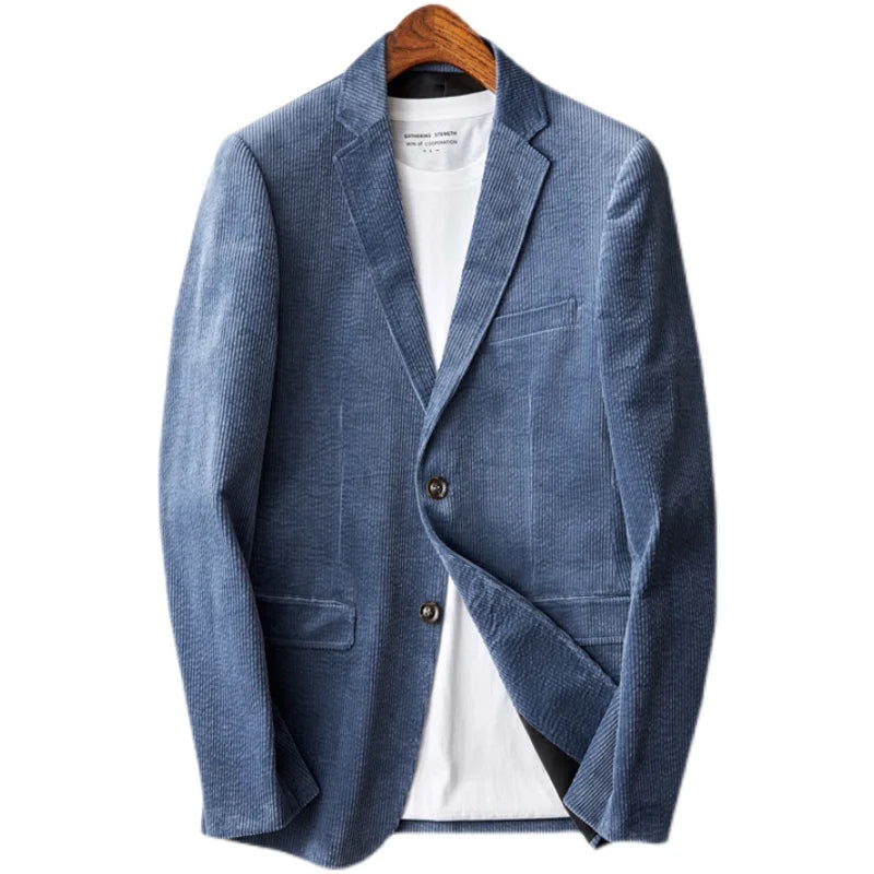 Men's light blue corduroy sport coat worn open over a white t-shirt