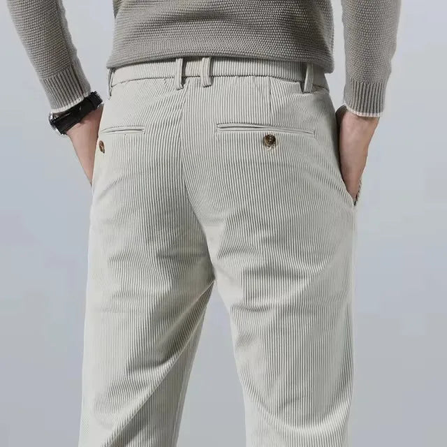 Back view of cream corduroy pants with buttoned back pockets
