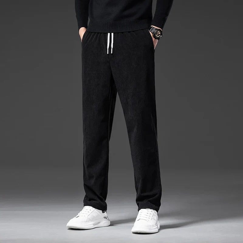 Men's black corduroy pants with elastic drawstring waist and straight leg