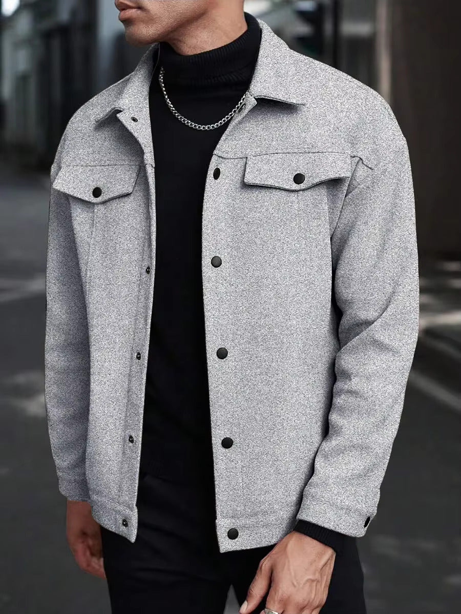 Gray trucker jacket layered over a black turtleneck