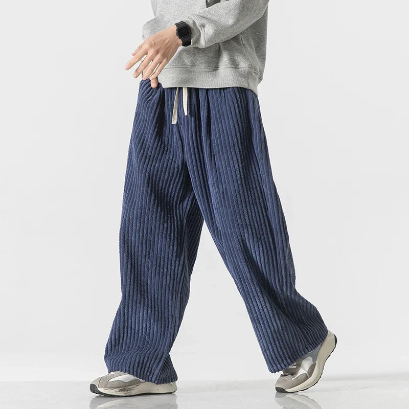 Men's wide-leg corduroy drawstring pants in ocean blue, walking view
