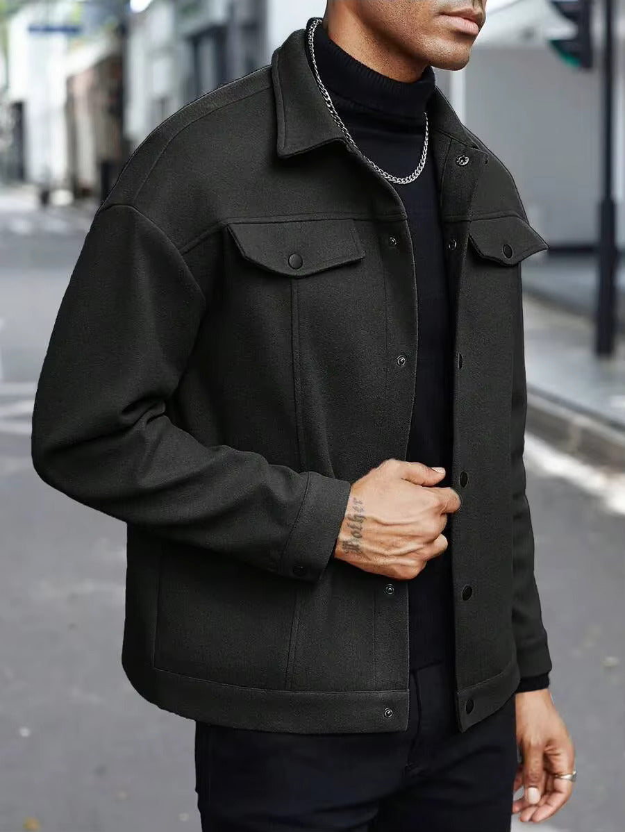 Side view of black button-up trucker jacket