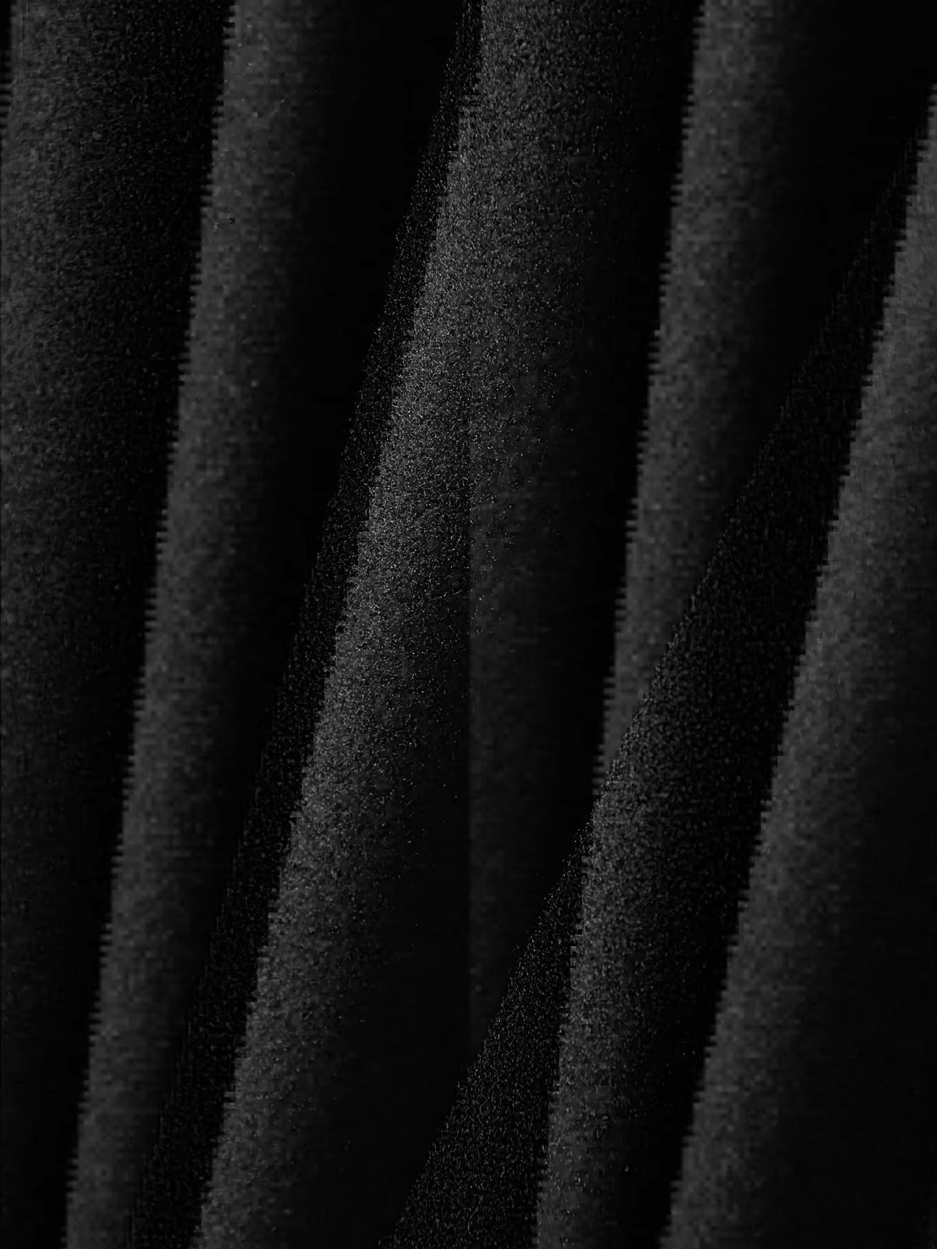 Close-up of brushed black fabric texture on trucker jacket