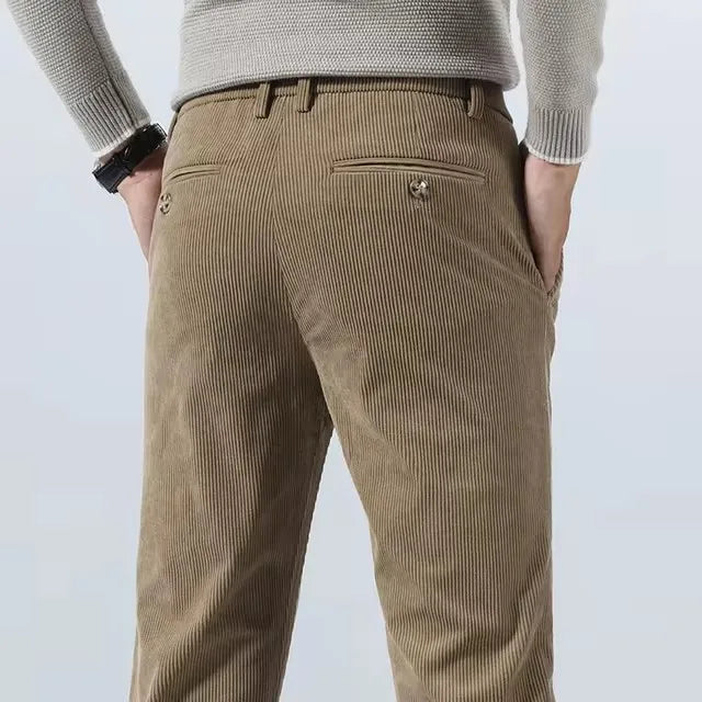 Back view of khaki corduroy pants with buttoned back pockets