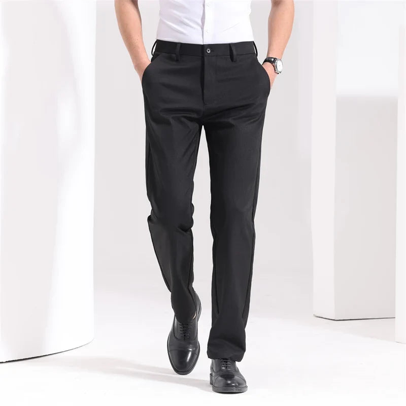 Men's slim-fit flat-front dress pants in black, front view