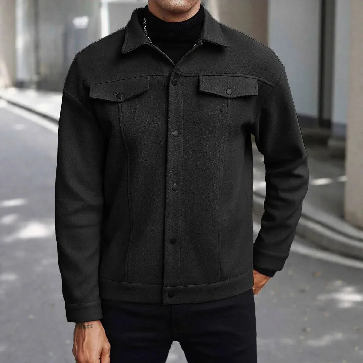 Men's black button-up trucker jacket with chest flap pockets