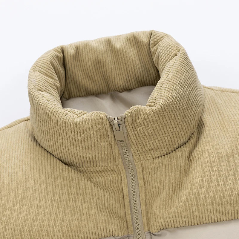 Close-up of the ribbed corduroy stand collar on a men's khaki quilted puffer vest