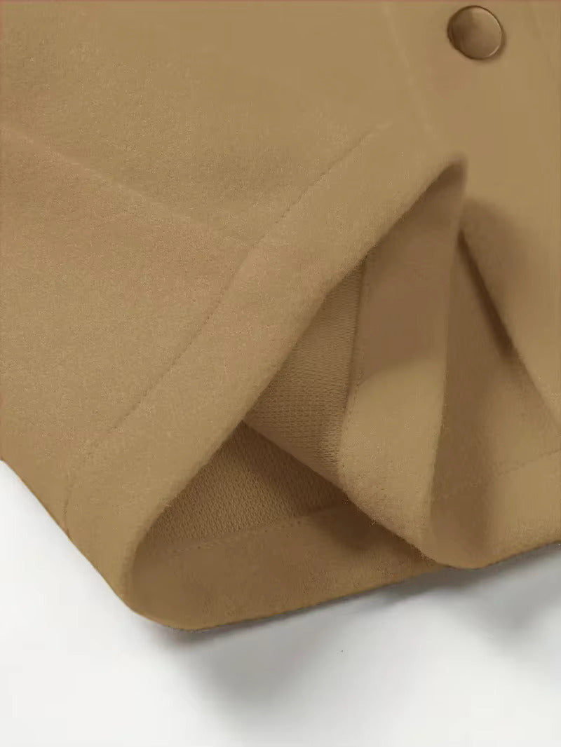 Close-up of brushed texture and button on brown trucker jacket