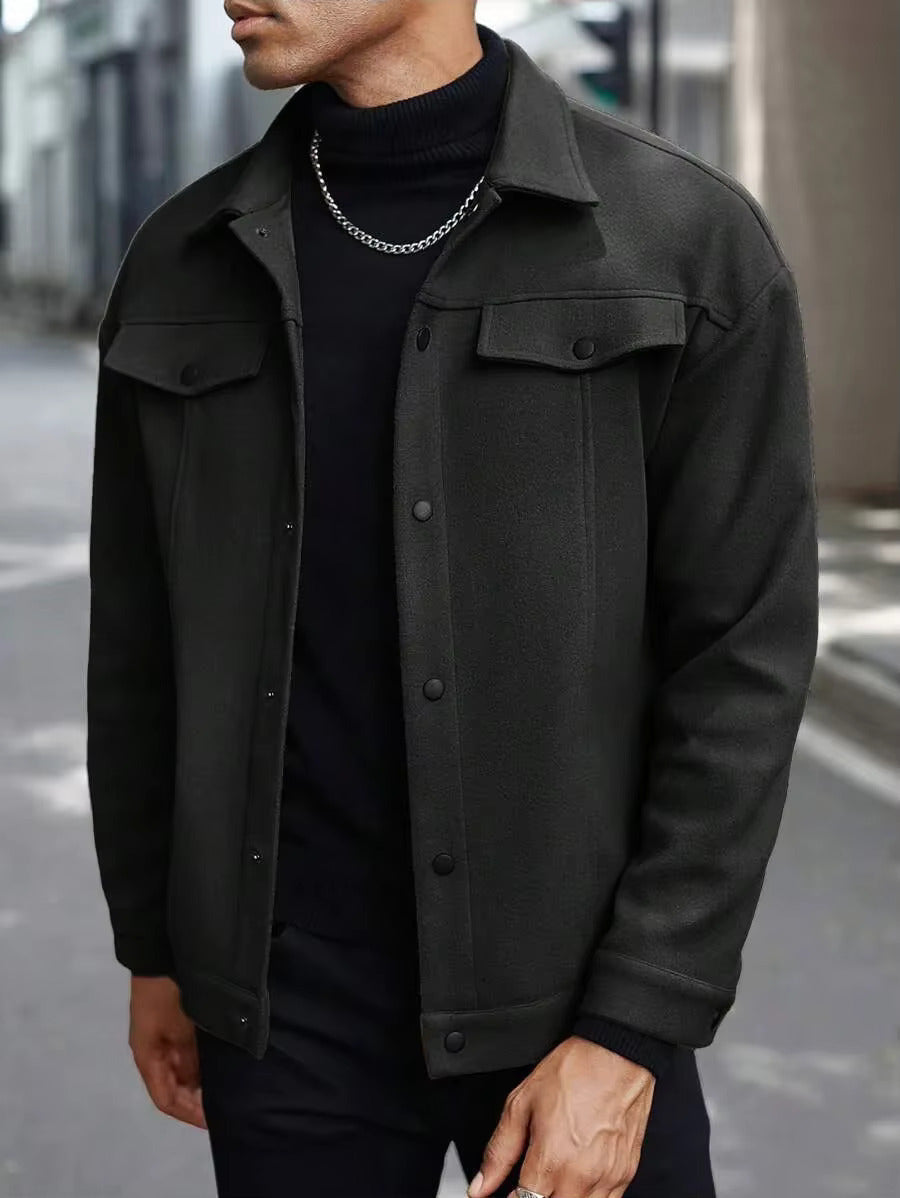 Black trucker jacket layered over a black turtleneck