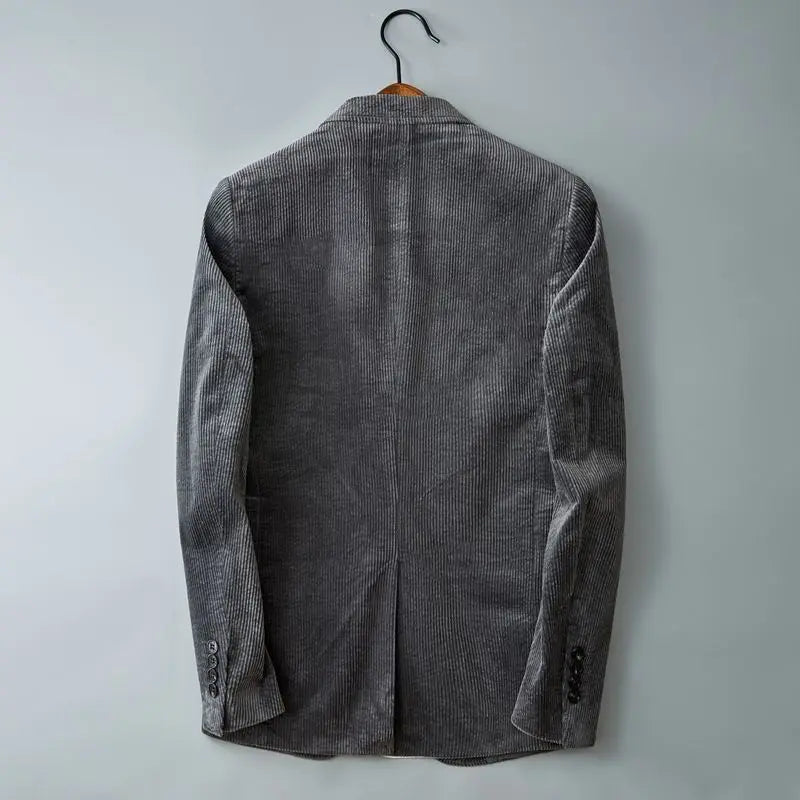 Back view of men's gray corduroy blazer with single vent and buttoned cuffs