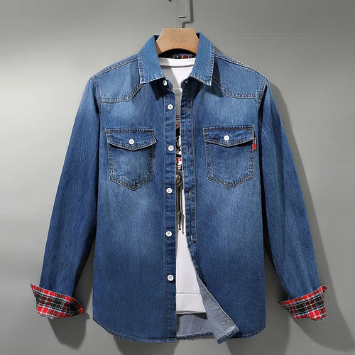 Men's light blue denim shirt with plaid-lined rolled cuffs on a hanger