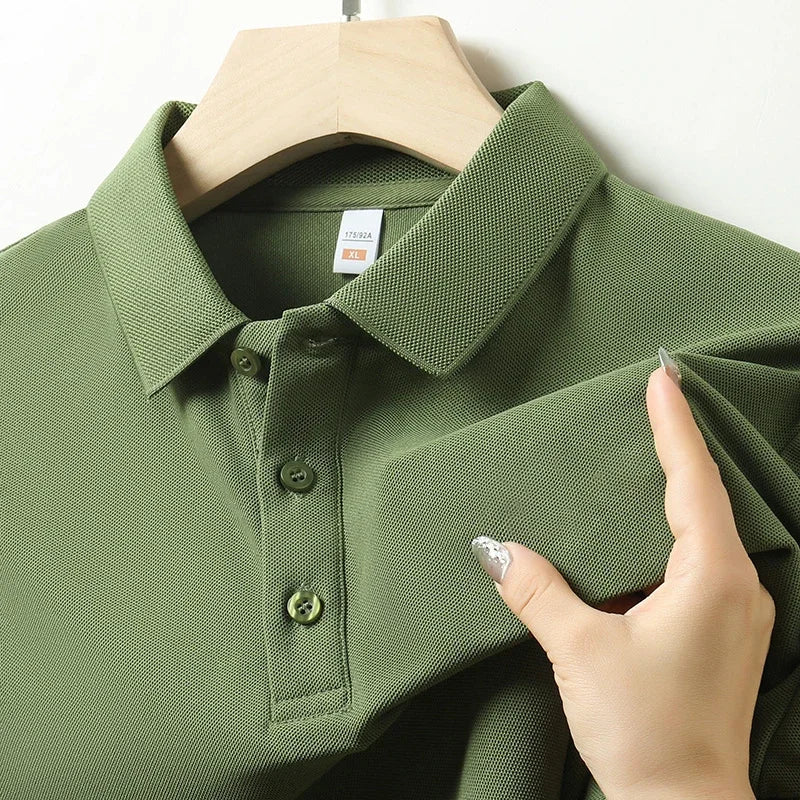 Close-up of the collar and button placket on a men's green textured polo shirt