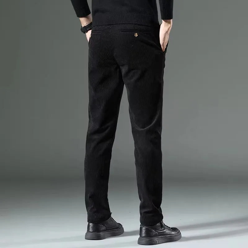 Back view of black slim-fit tapered corduroy pants