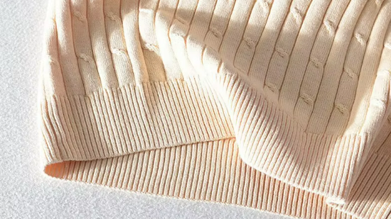 Women's Classic Cable Knit Crewneck Sweater with Ribbed Trim in Khaki, close-up of the ribbed hem
