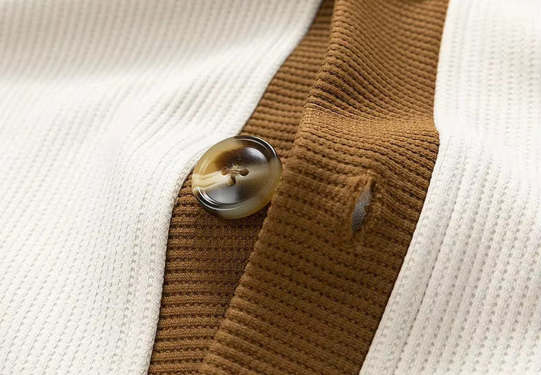 Men's Button-Up V-Neck Cardigan with Striped Sleeve in White, close-up of a button