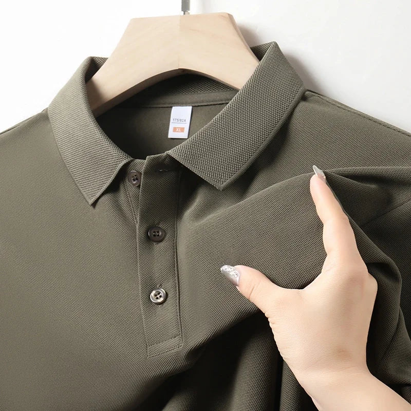 Close-up of the collar and button placket on a men's dark green polo shirt