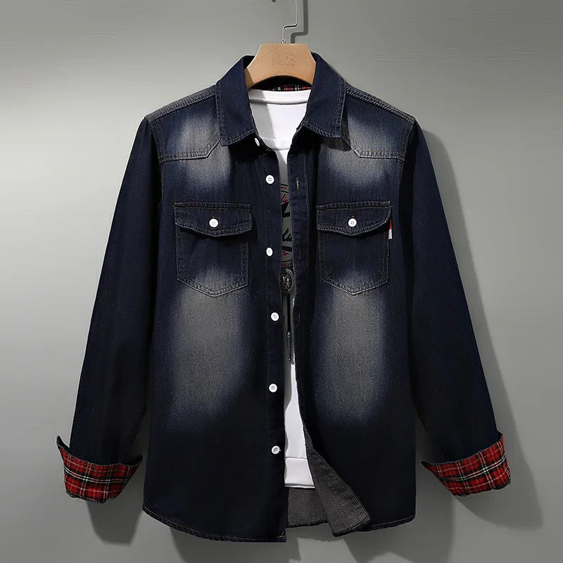 Men's dark blue denim shirt with plaid-lined rolled cuffs on a hanger