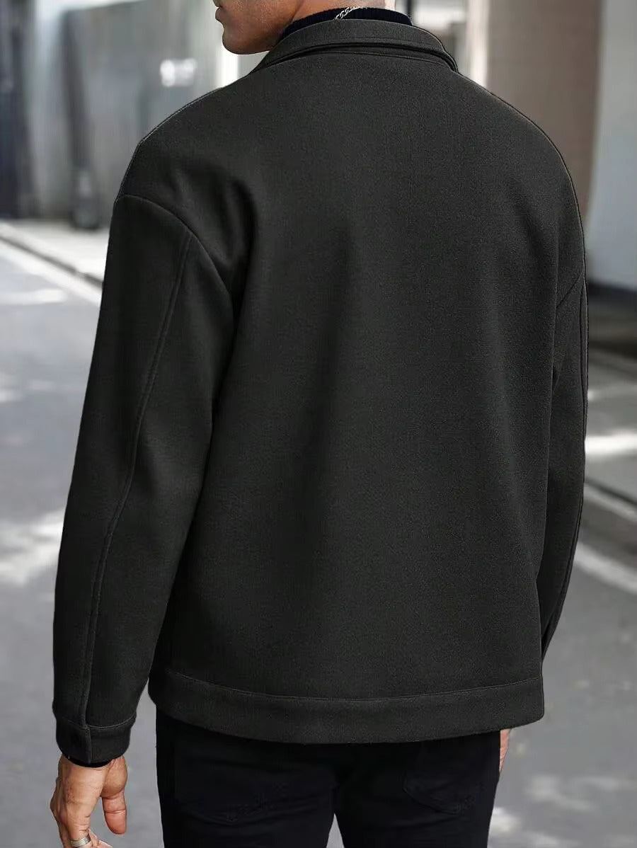 Back view of men's black trucker jacket