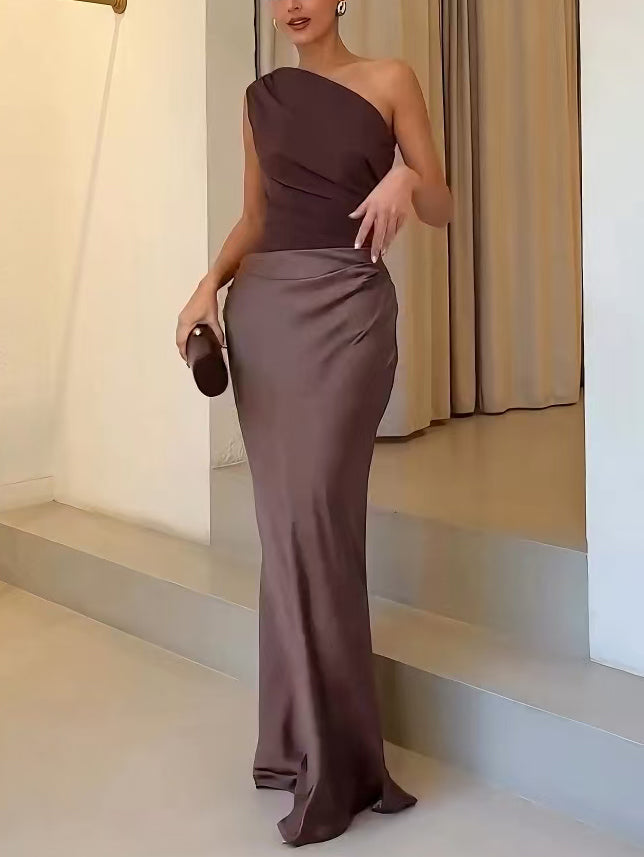 Women's brown ruched one-shoulder dress with draped sash at the hip