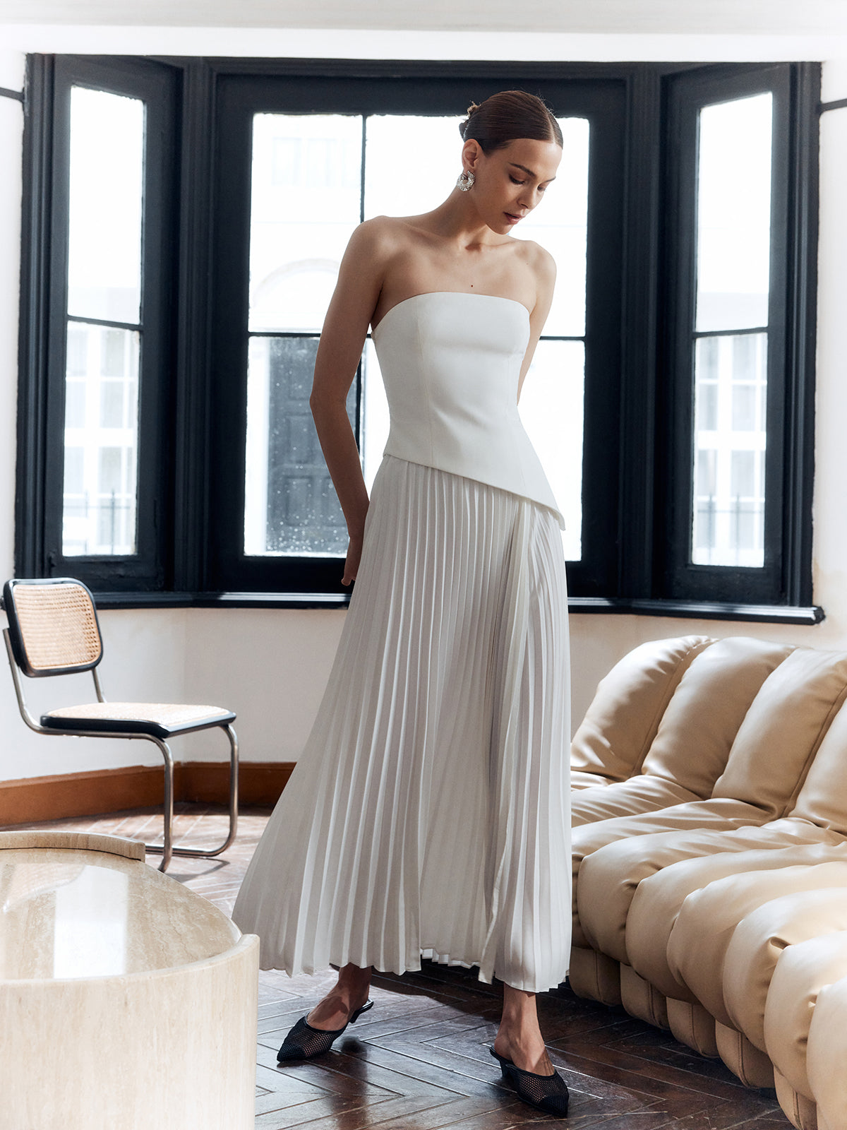 Women's white strapless maxi dress with pleated floor-length skirt