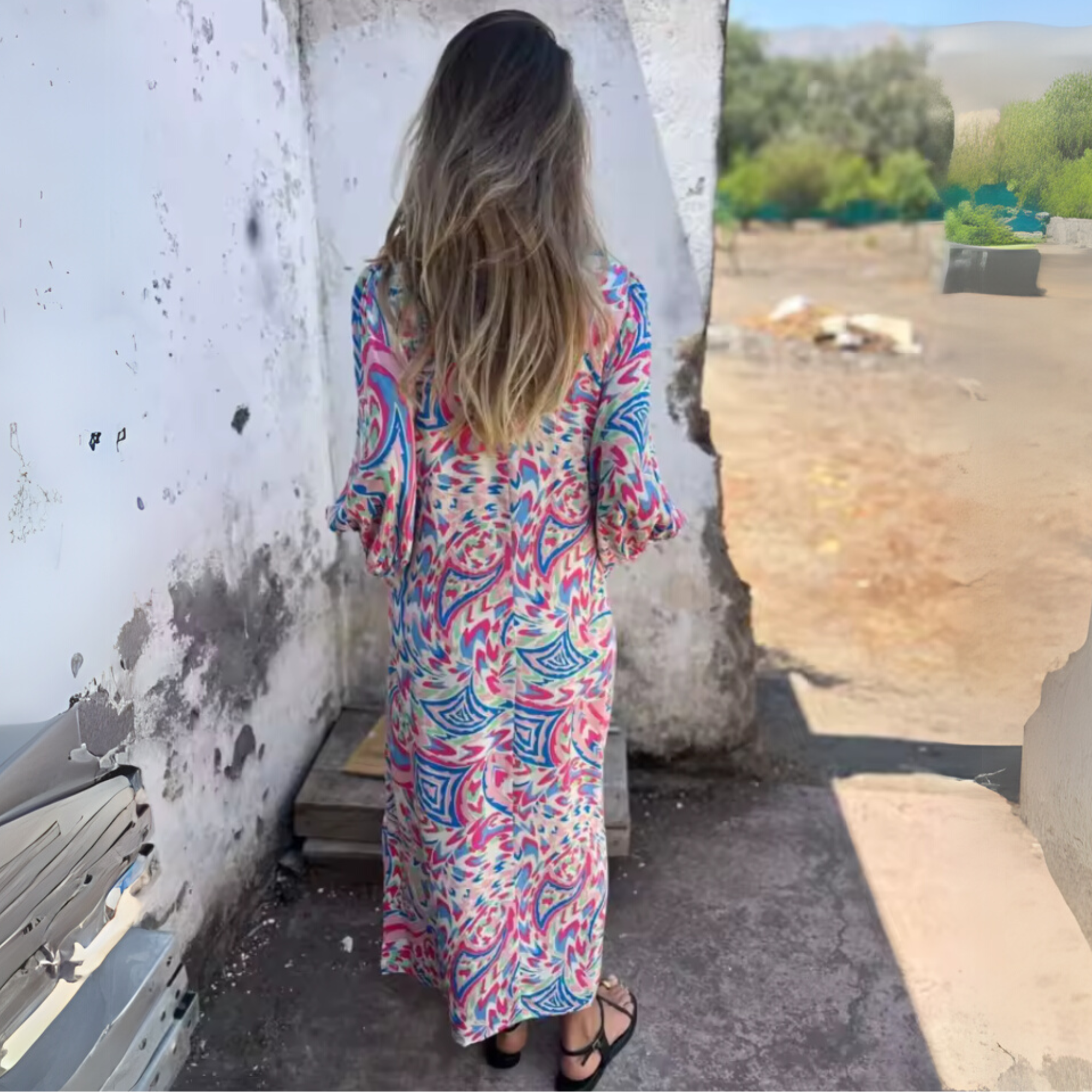 Back view of women's multicolor swirl print maxi dress with blouson sleeves