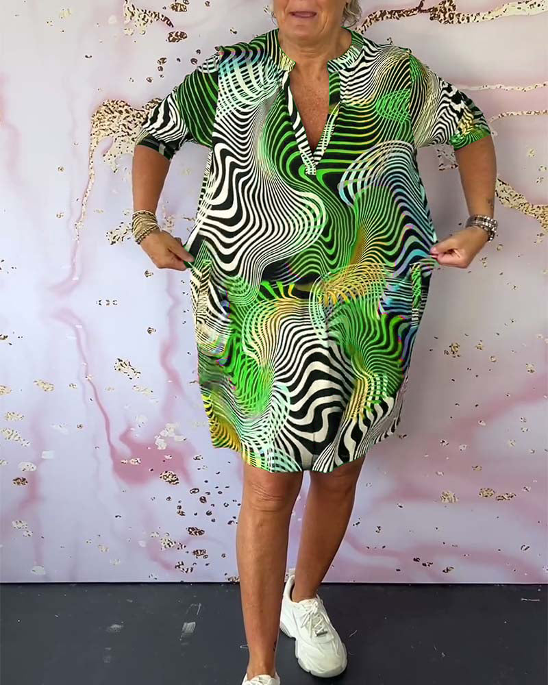 Women's multicolor print shift dress with side pockets and knee-length hem