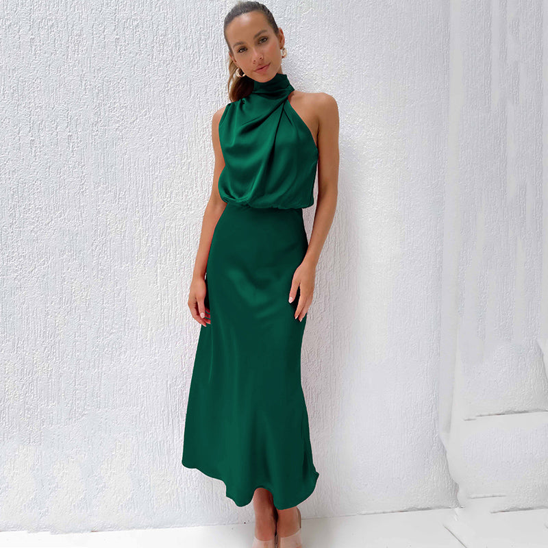 Women's Sleeveless Satin Halter Neck Midi Dress in Dark Green, on model