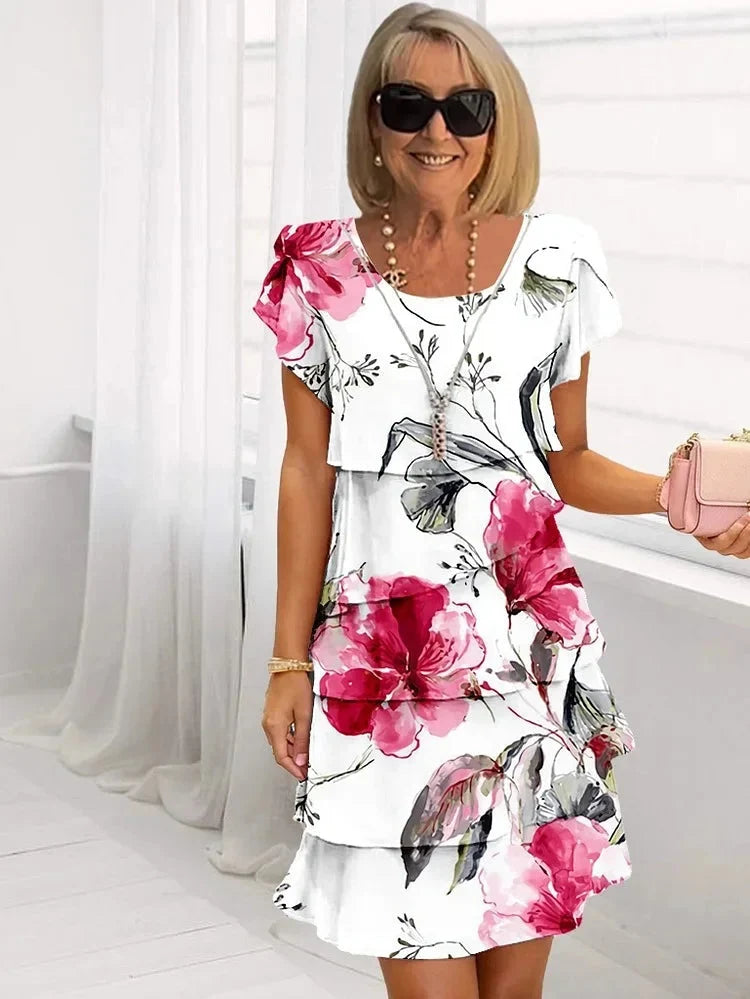 Women's white floral tiered dress with flutter sleeves, knee length