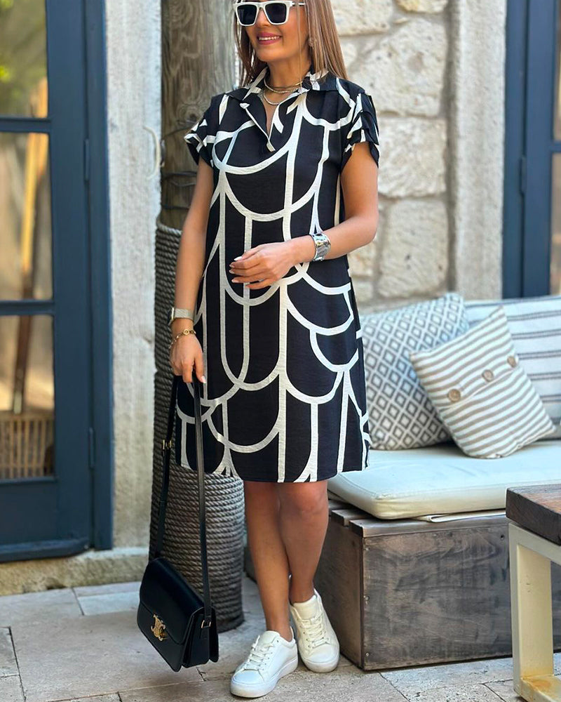 Women's black and white arch print shift dress with knee-length hem